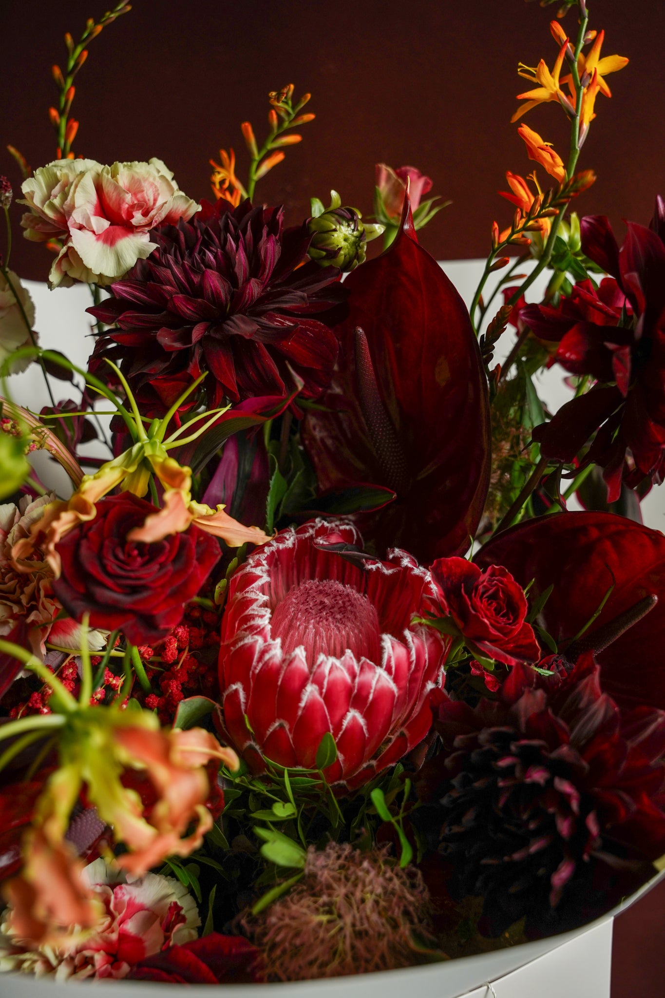 Studio Ode The Dramatic moody red and burgundy floral arrangement close-up detail