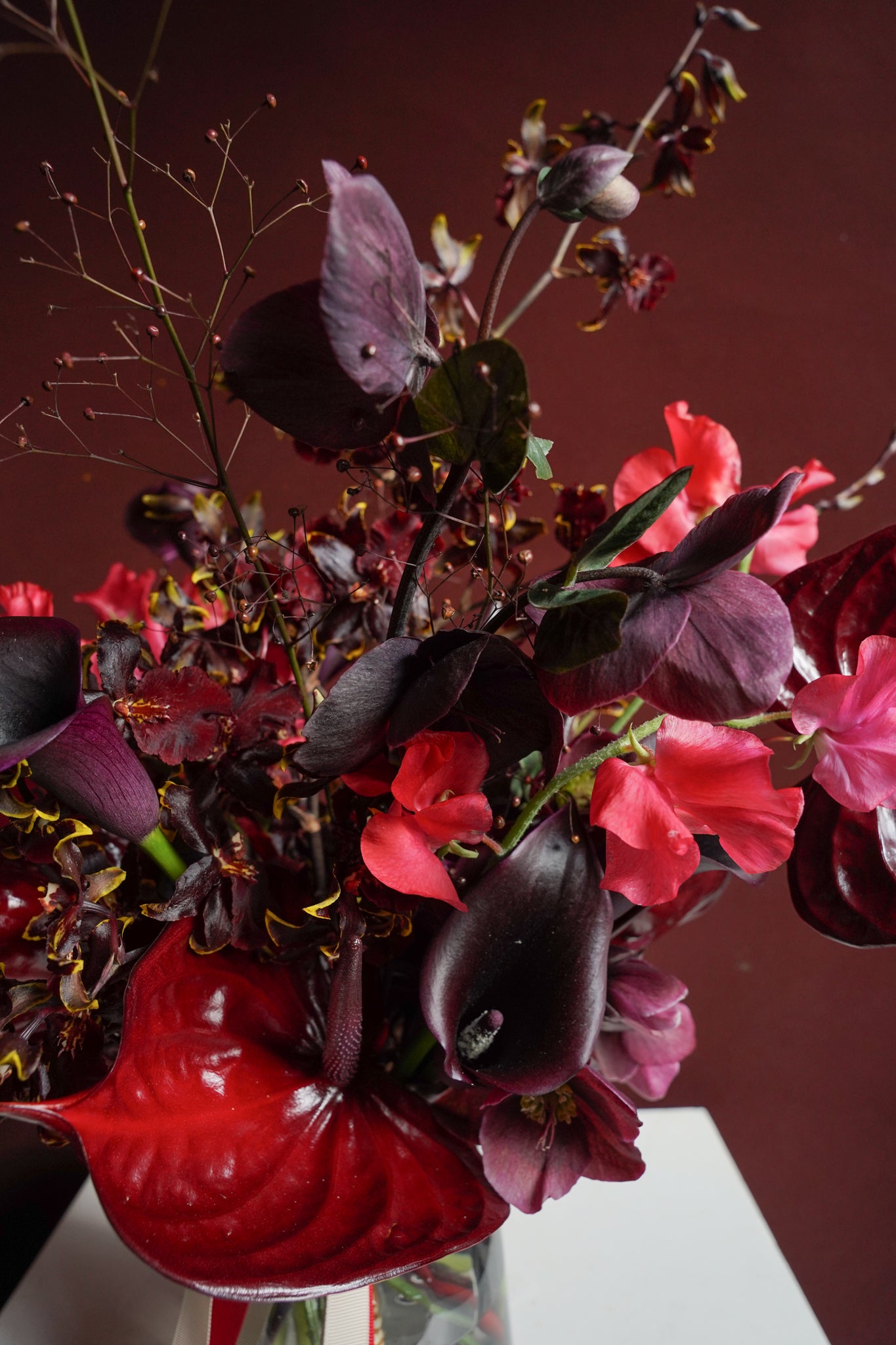 Studio Ode The Dramatic moody red and burgundy floral arrangement close-up detail